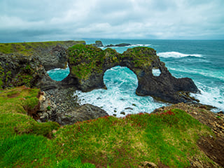 A picture of the Gatklettur basalt rock arch at Arnarstapi