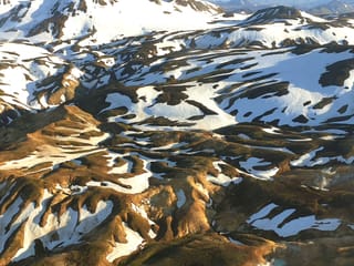 Landmannalaugar mountains covered with patches of snow