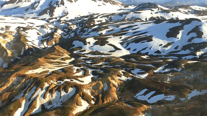 Landmannalaugar mountains covered with patches of snow