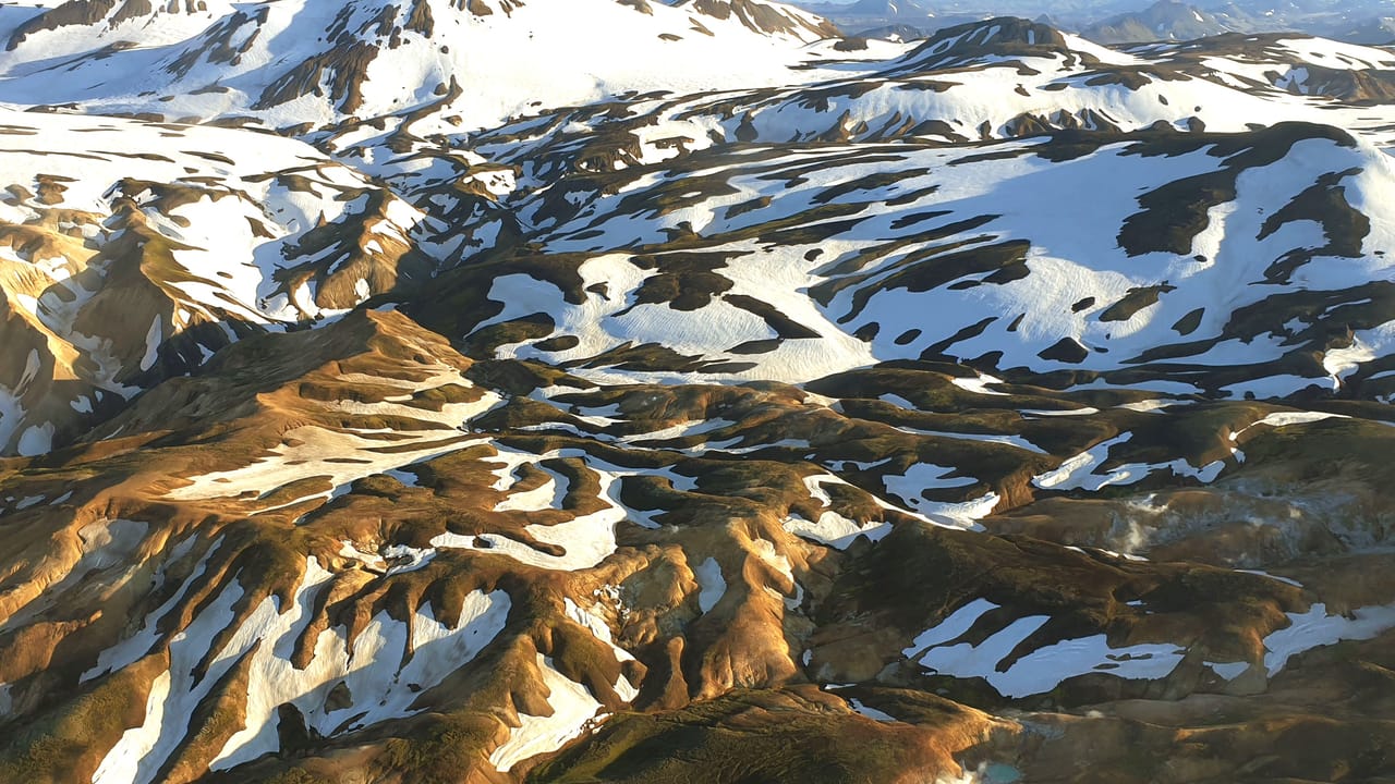 Landmannalaugar mountains covered with patches of snow