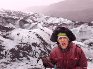 Woman screaming like a Viking on the glacier.