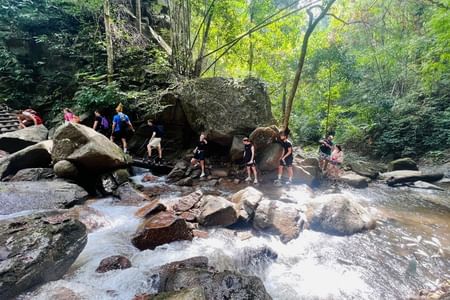 Trek to Tard Mok Waterfall, River Tubing & Hidden Waterfall Slide