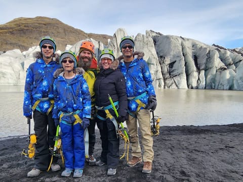 Standing in front of the glacier outlet.