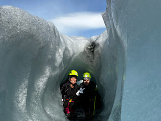 People in a crevasse for a cool photo on the glacier
