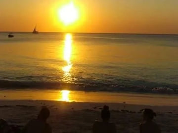 Traditional dhow at sunset off Pemba