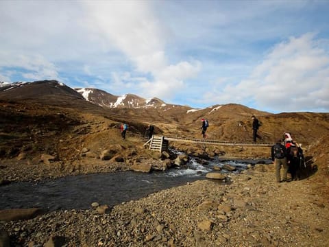 Hikers crossing a bridge