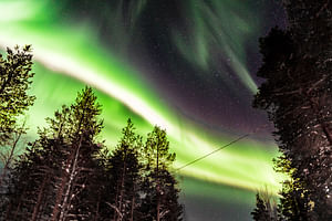 Hunting Northern Lights by Snowmobiles