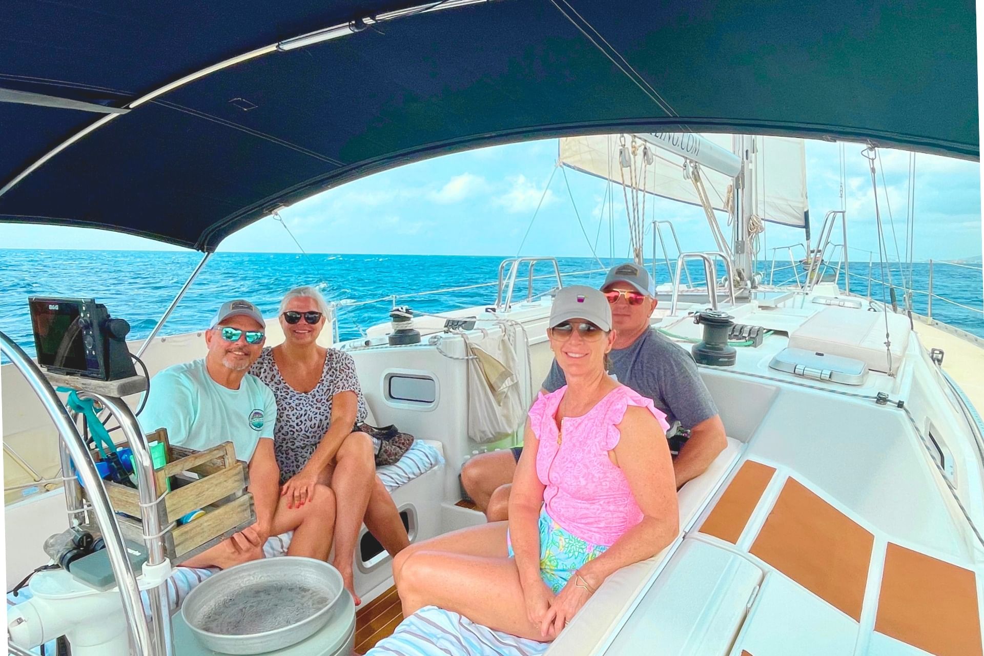 Friends celebrating while sailing at morning with Maxie Sailing Curacao