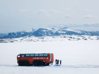 Red Truck on Glacier, with Munt Blafell in the background