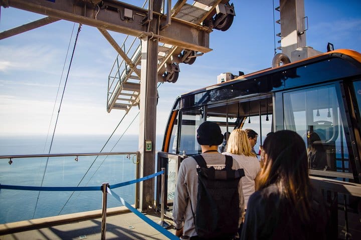Travelers board the cable car to Mt. Srd.