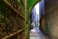 An empty narrow back alley in the historic center of Barcelona - off-the-beaten-track