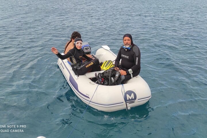 Tour participants on inflatable boat ready to dive in Siracusa