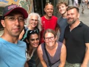 Tour guide Christian (on the right) with a group of guests in front of the famous concert hall of Barcelona