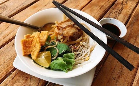 Biking Tour of Hoi An's Culinary Highlights and Tra Que Village