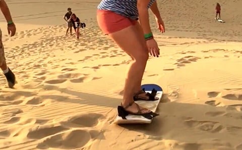 Morning Desert Safari with Camel Farm Visit & Sandboarding