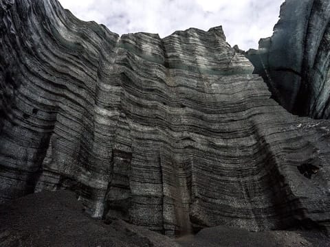 Katla Glacier cliff covered in volcanic ash