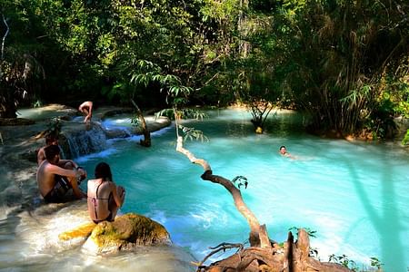 Explore Kuang Si Waterfall: Cycling, Swimming & Mekong River Cruise