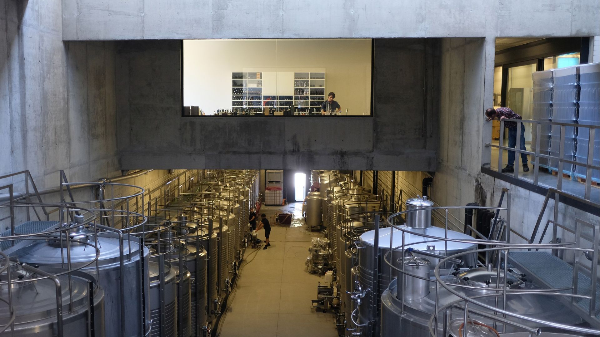 Image of a winery room with stainless steel barrels for Douro wine production, with the wine lab, on Cooltour Oporto's Douro Valley Tour