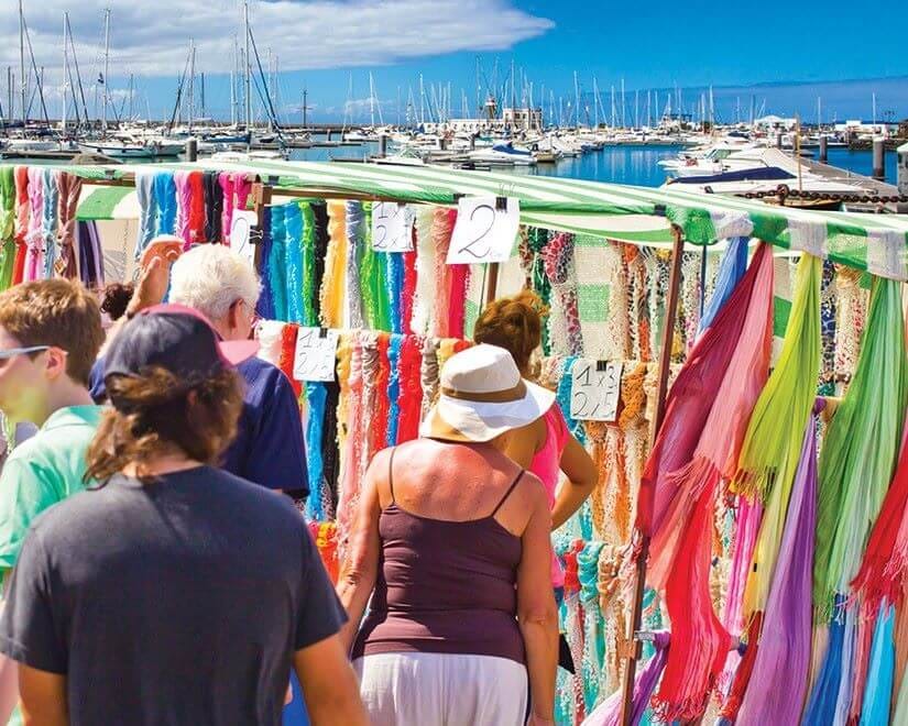 Marina Rubicón market in Lanzarote with shops and yachts