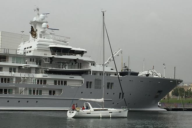 No Limits passing one of the many impressive Super Yachts