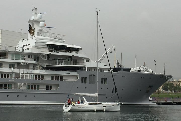 No Limits passing one of the many impressive Super Yachts