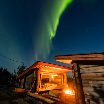 Watching the Northern Lights from a campfire on a reindeer pasture in Rovaniemi - Image 8