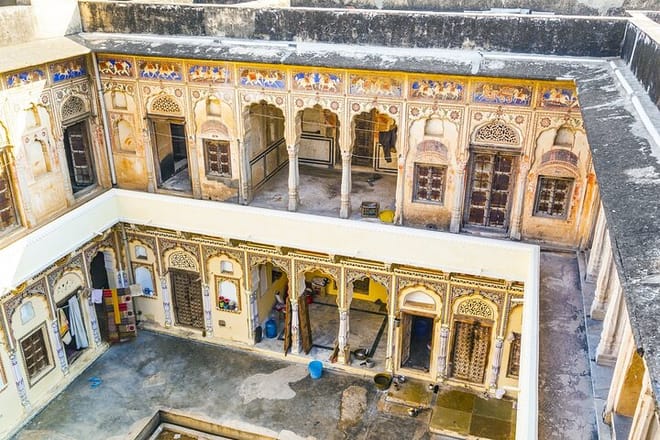 People in beautiful old haveli in Mandawa