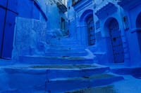 Discover the enchanting blue streets of Chefchaouen, where every corner reveals vibrant hues and serene beauty.