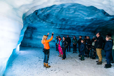 Woman talking to Group in Ice Cave