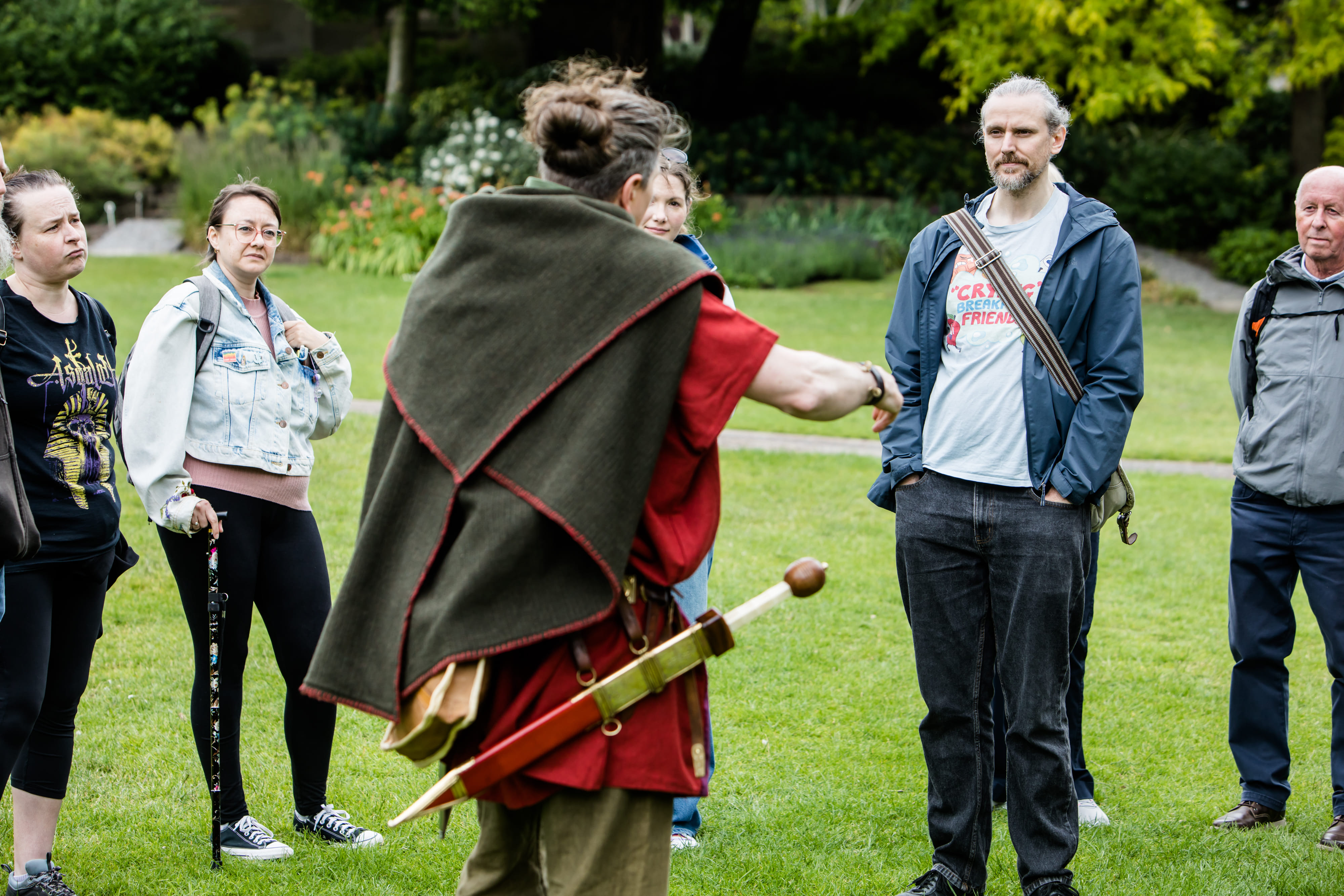 We see the back of the Roman-costumed guide, talking to his tour guests in the beautiful Museum Gardens, York.