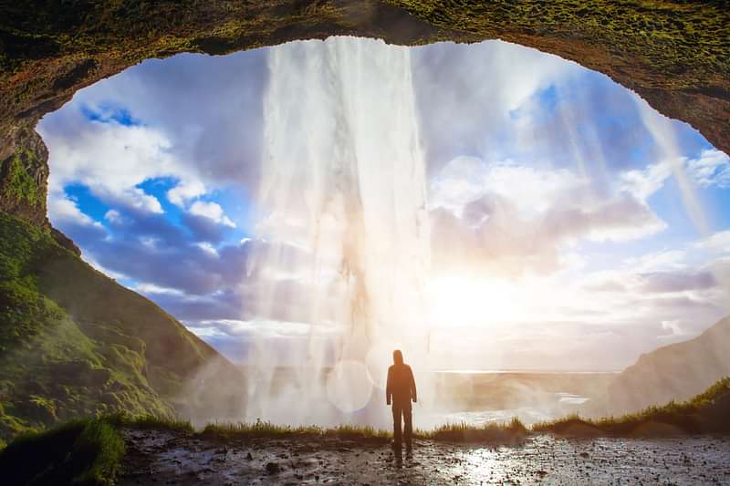Seljalandsfoss Waterfall with Man behind Waterfall 