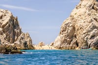 Discover Lover's Beach nestled between the iconic cliffs of Cabo San Lucas.