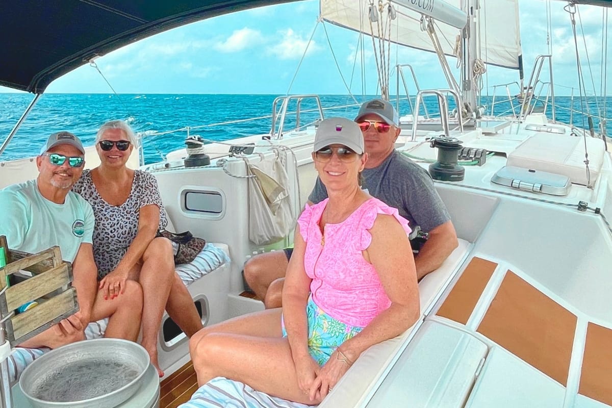 Family enjoying sailing Caribbean Sea during a private tour by Maxie Sailing in Curacao