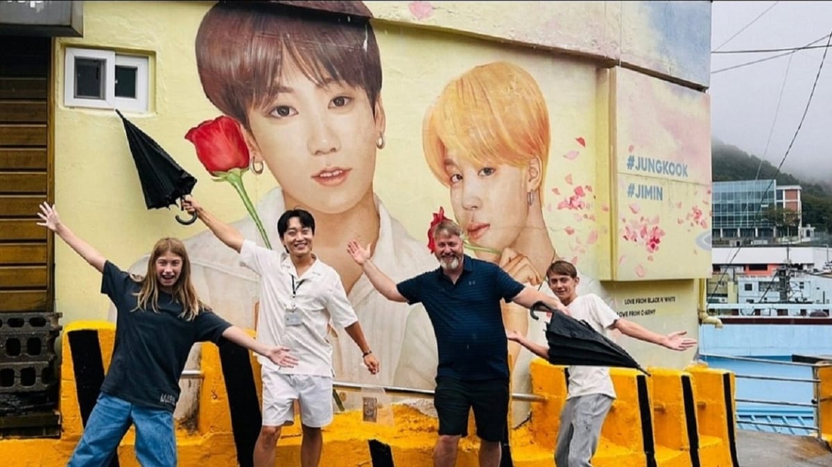 A fun photo spot featuring BTS and K-pop murals in Gamcheon Culture Village.
