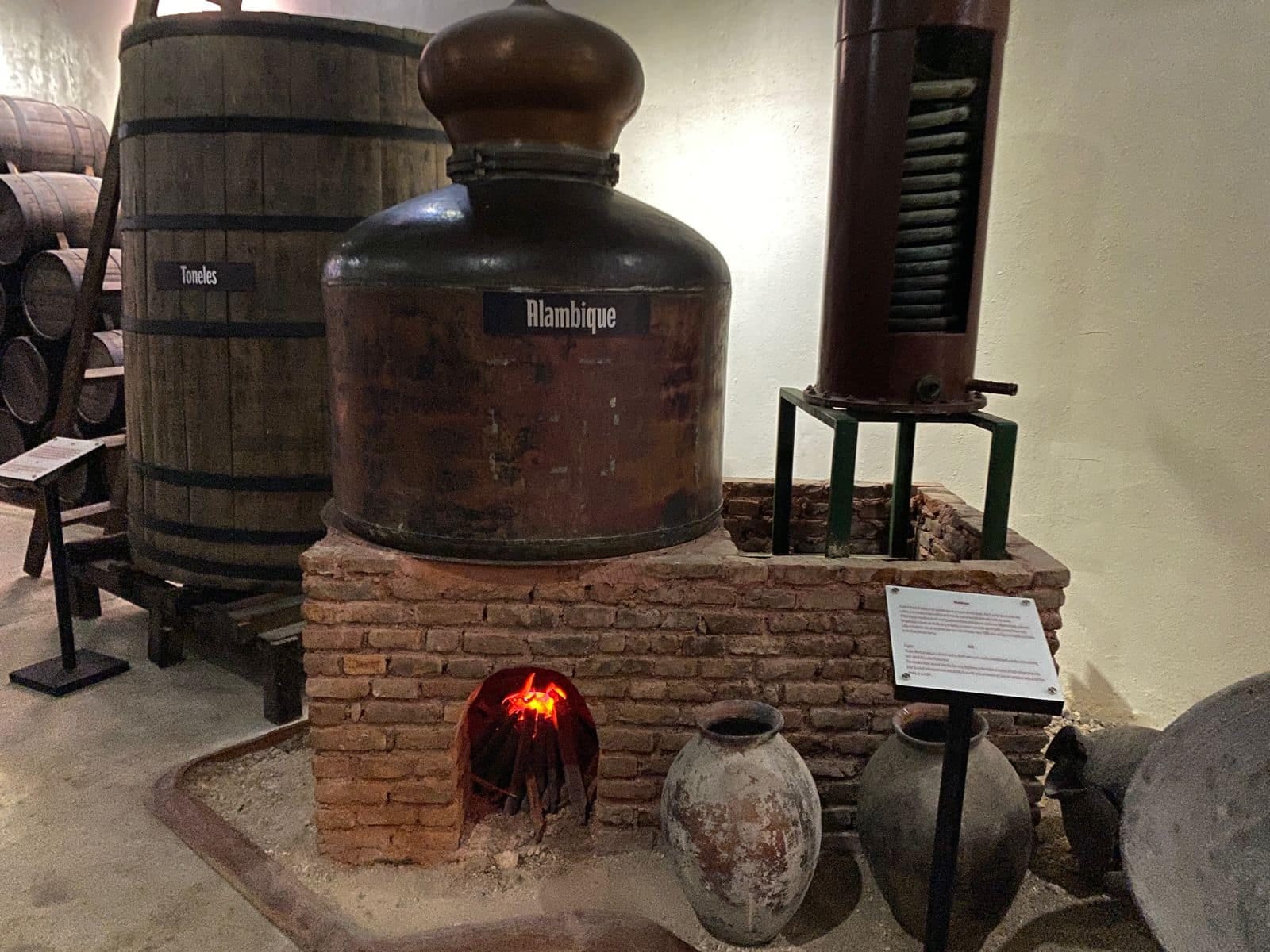 Old still and historical distillation elements exhibited during the tour at the Ron Barceló Historical Center.