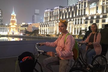 Shanghai Night Cycling Tour with Food and Skyline Views