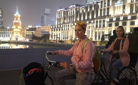 Shanghai Night Cycling Tour with Food and Skyline Views