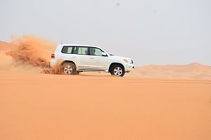An Evening Desert Safari with Dinner and Live Entertainment