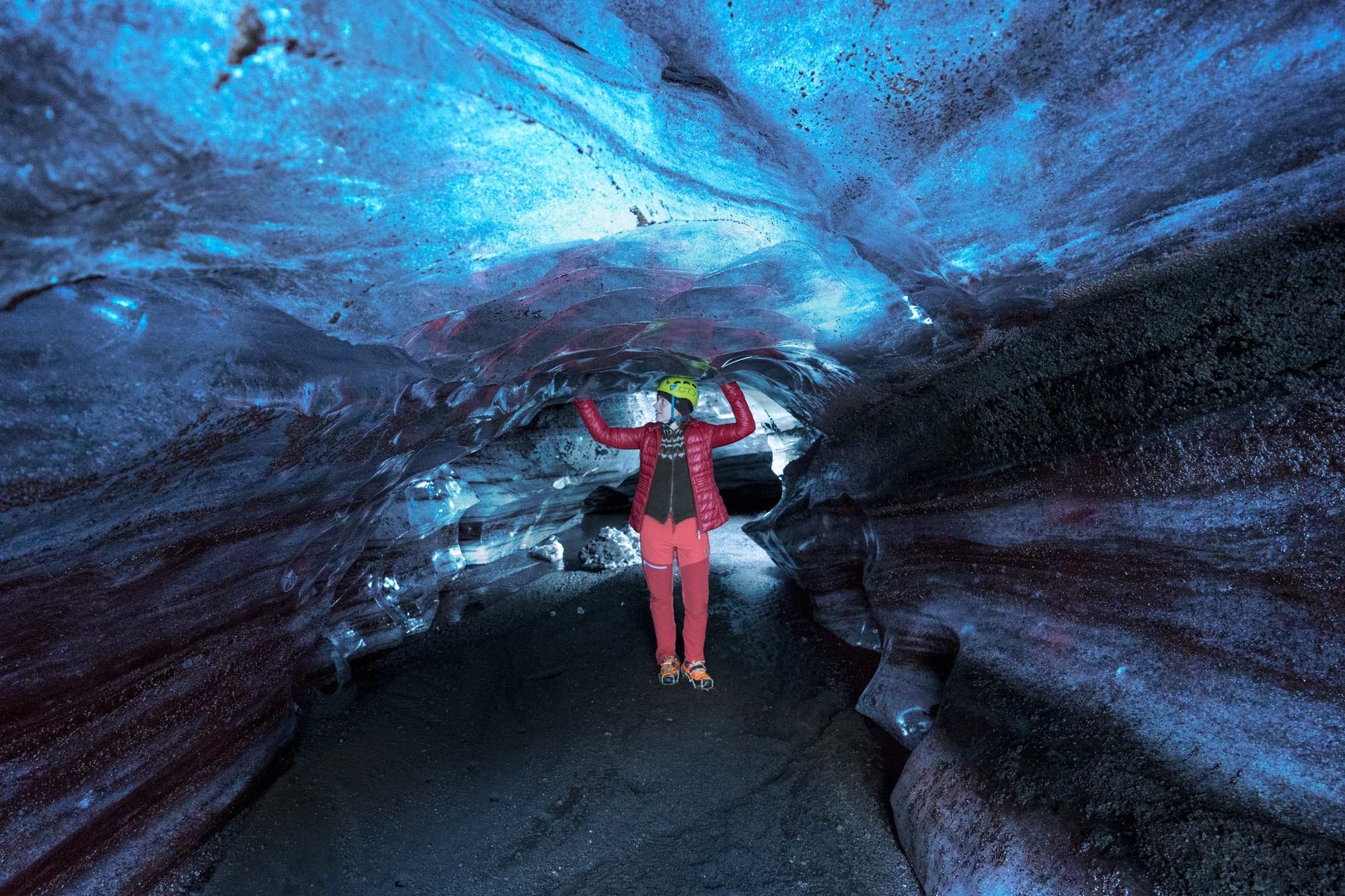 Woman inside ice cave.