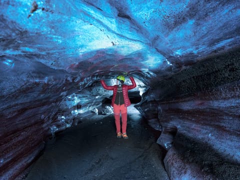 Woman inside ice cave.