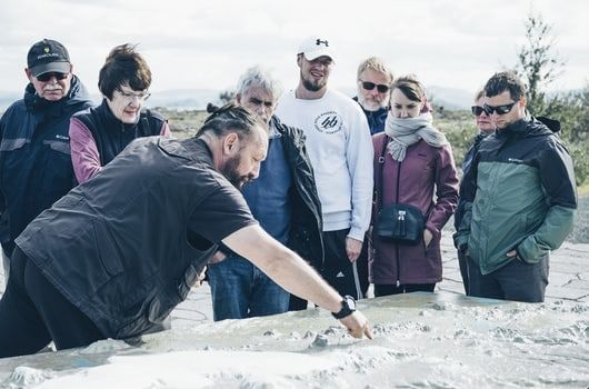 Guide giving a geology lesson at Thingvellir National Park