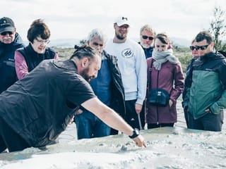 Guide giving a geology lesson at Thingvellir National Park