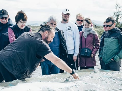 Guide giving a geology lesson at Thingvellir National Park