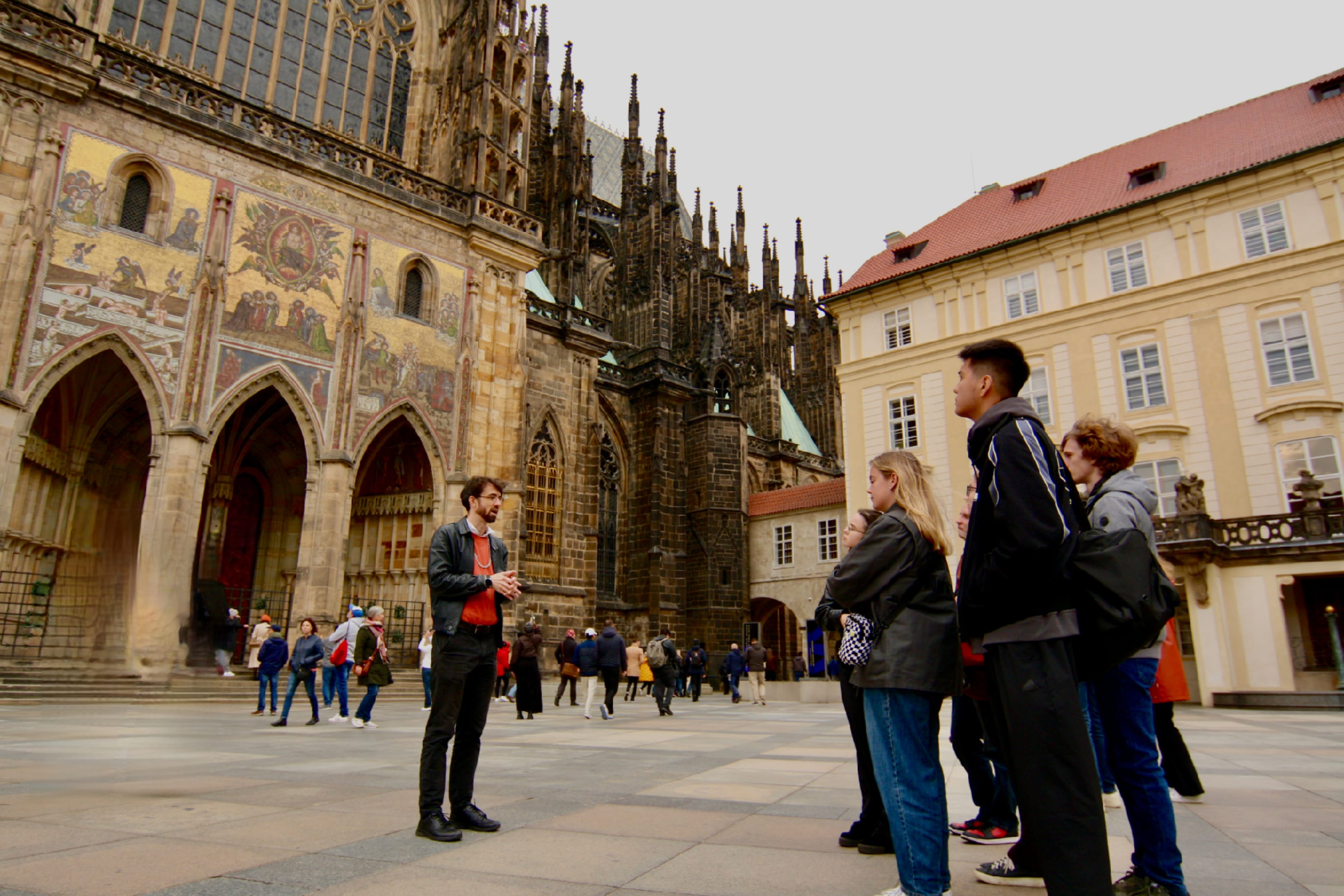 tour guide in front of St. Vitus Cathedral with a group of tourists 