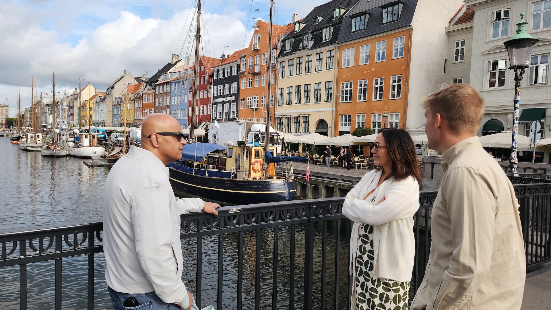 Local guide takes a small group through the streets of Christianshavn, Copenhagen