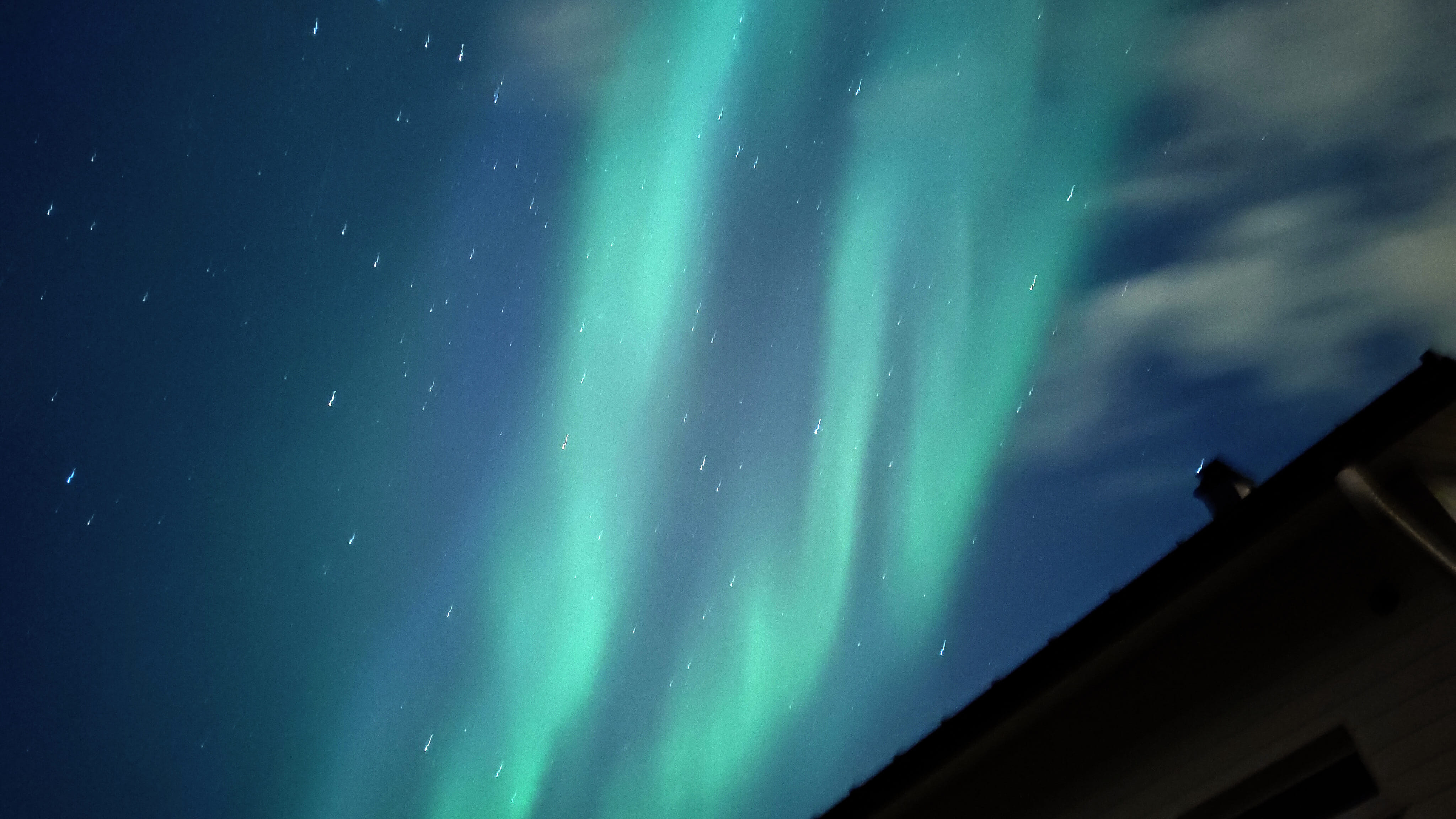 Aurora borealis forming bright bands in the sky