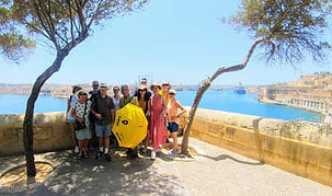 A group enjoying panoramic views during one of our Valletta Food Tours