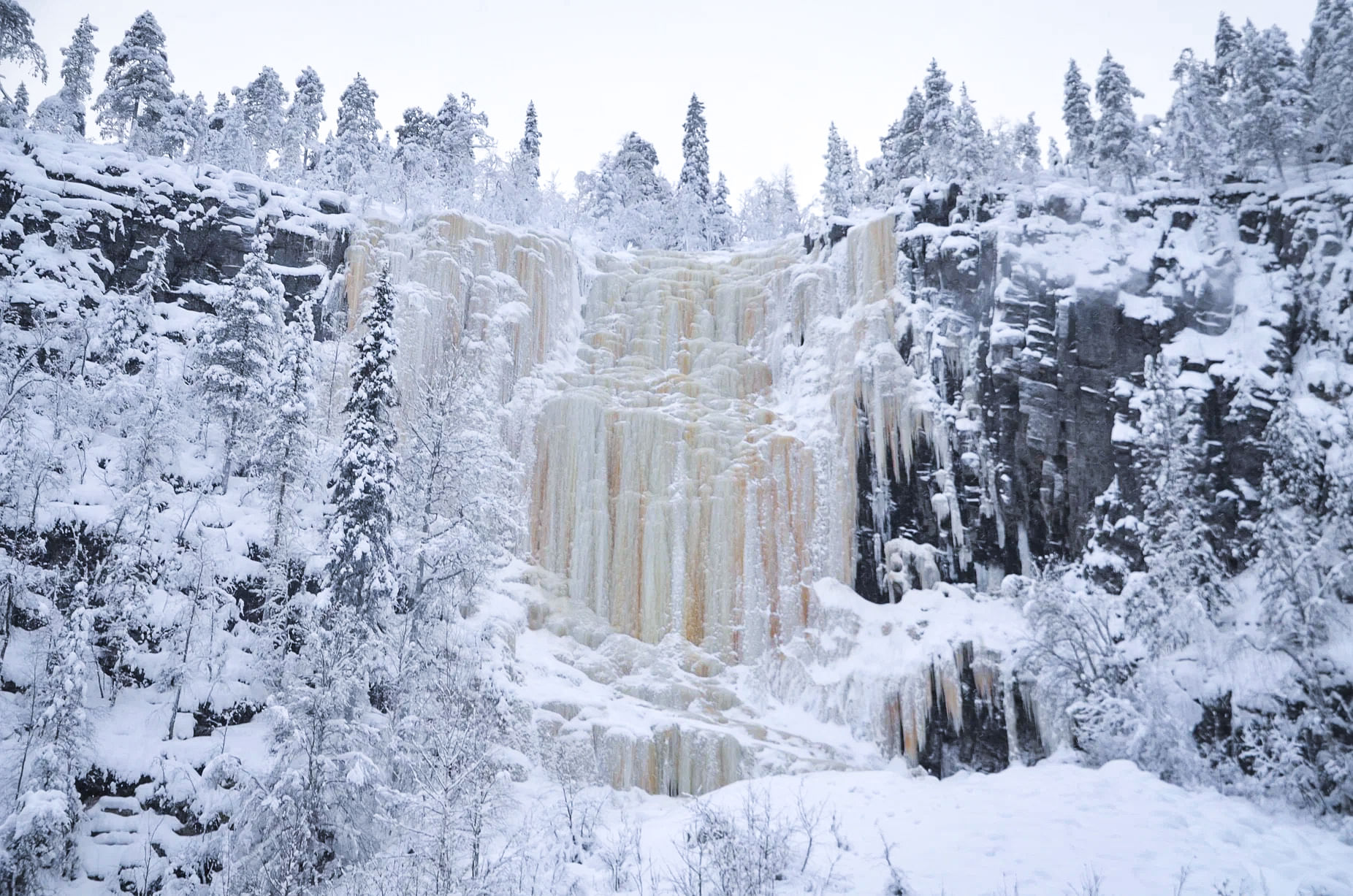 Majestic frozen waterfalls in Korouoma Canyon