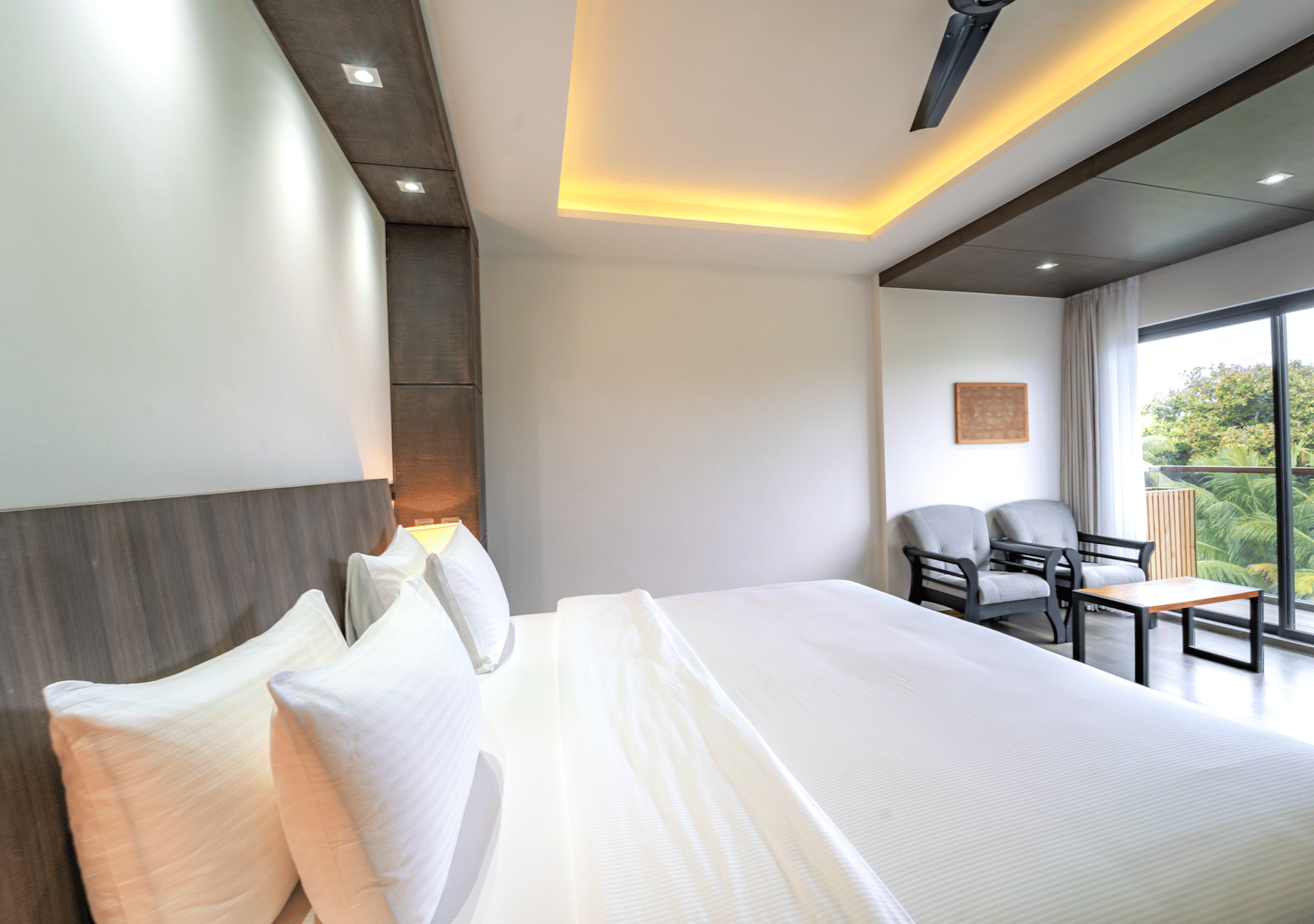 A cozy and well-made bed in a room at Aroom Ataraxis Grand and Spa Fuvahmulah.