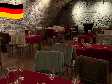 Weinprobe im Dunkeln in einem historischen Keller aus dem 17. Jahrhundert.